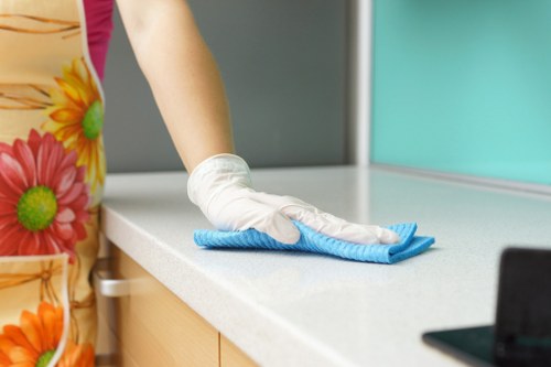Cleaning technician preparing equipment for a safe carpet cleaning job