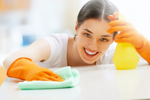 Team member using protective gloves during carpet cleaning